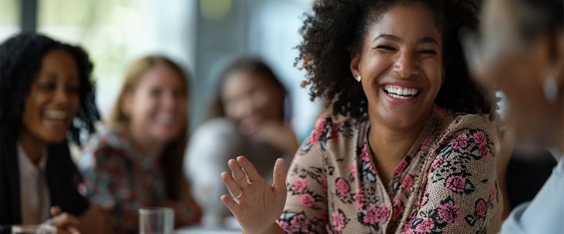A group of mission-driven leaders sharing a joyful conversation